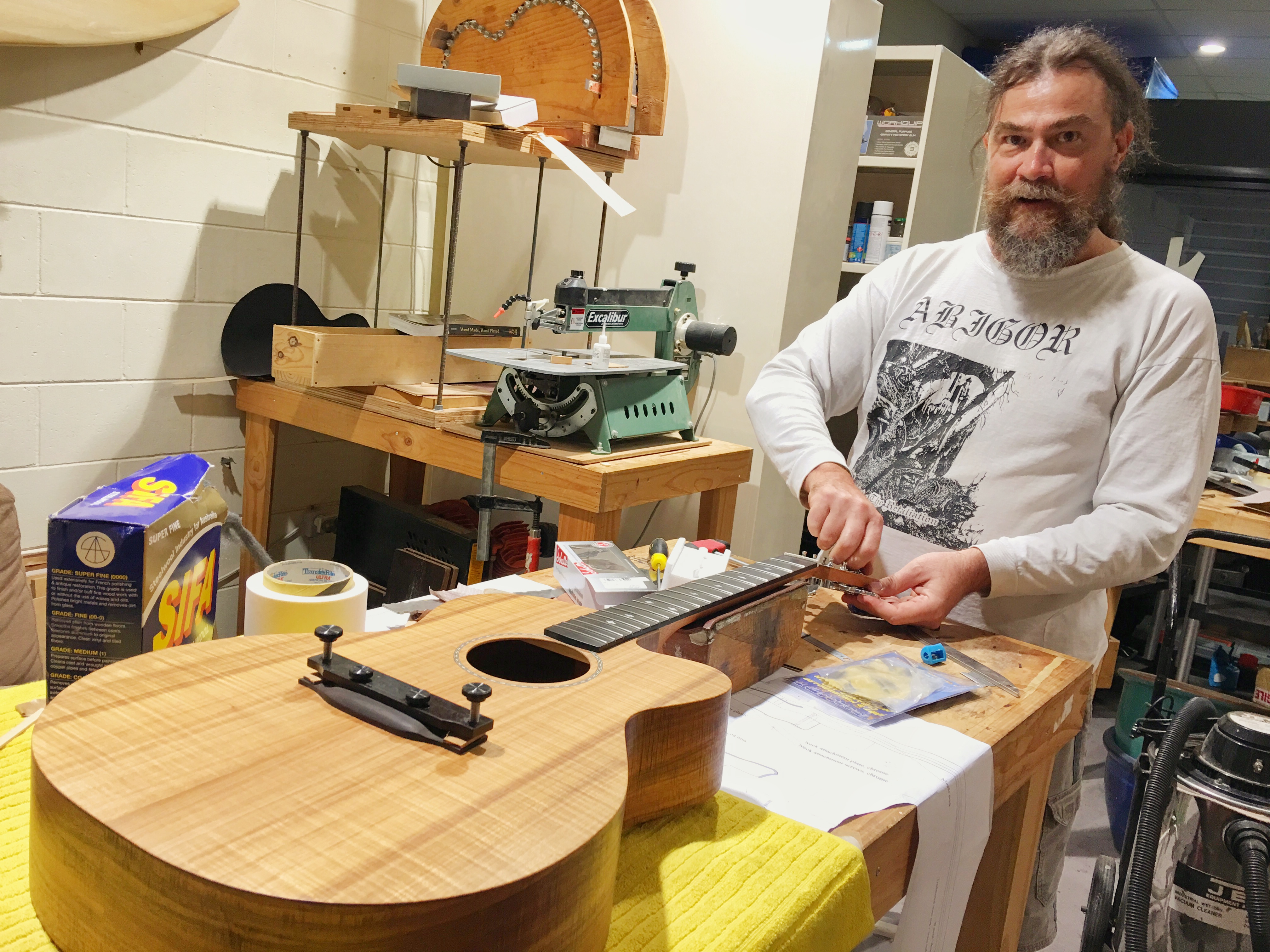 Blair working on his Orchestra Model acoustic guitar