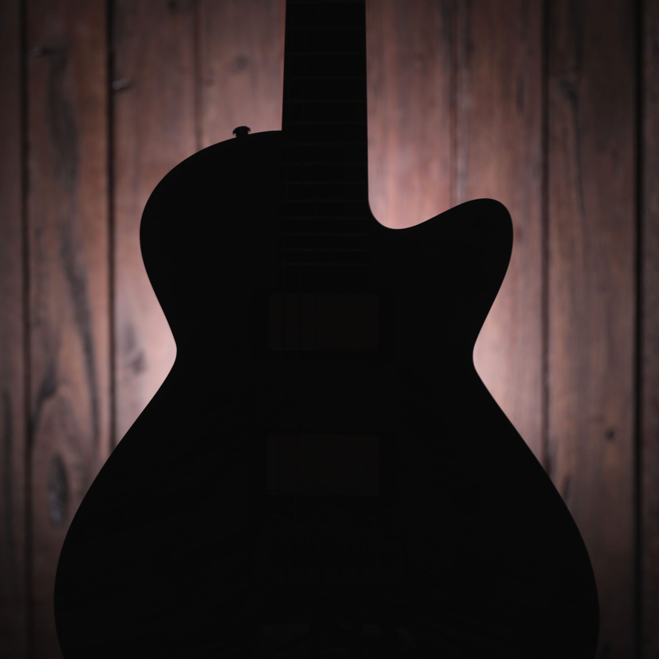 Guitar Silhouette with Timber Background